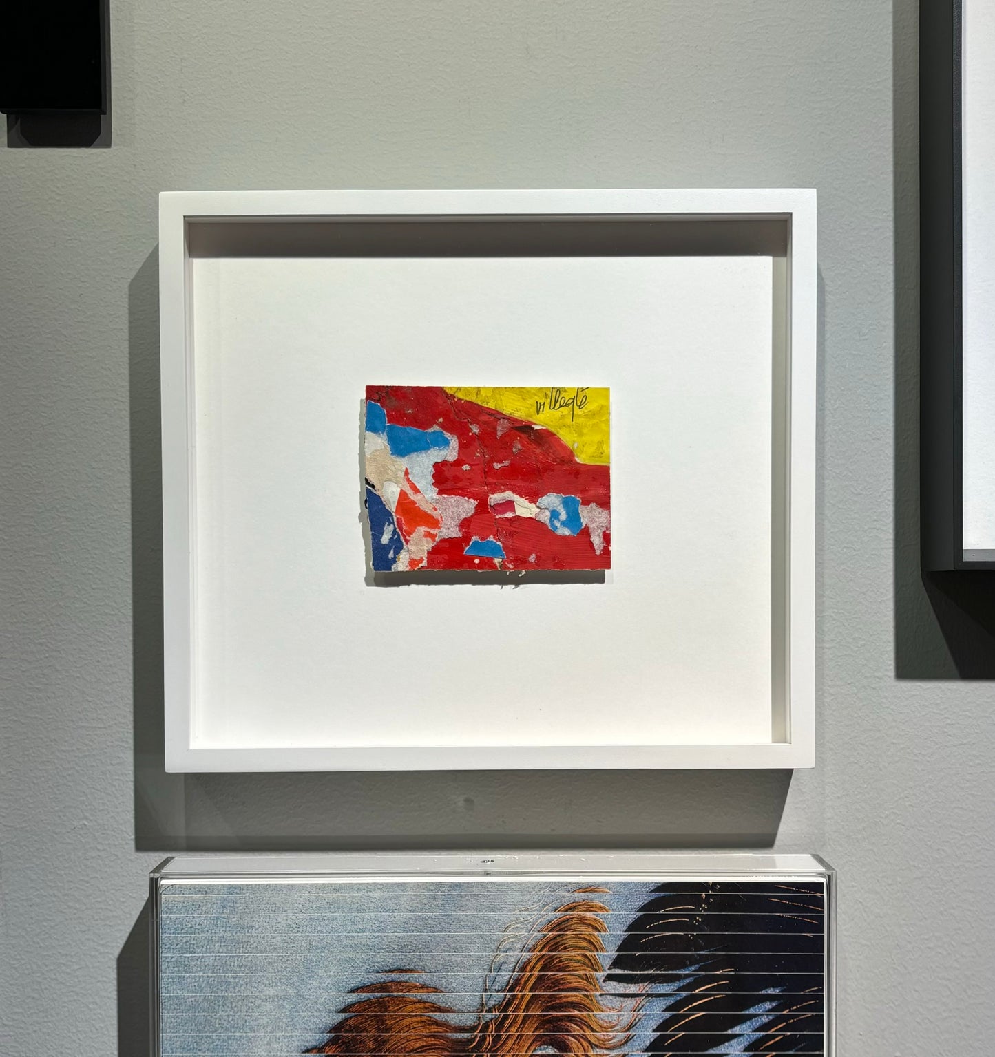Untitled (1963) by Jacques Villeglé – Décollage artwork, signed top right. Framed view showing the artwork within its elegant frame. The piece highlights Villeglé's distinctive method of using torn posters to create abstract compositions, reflecting the urban environment.
