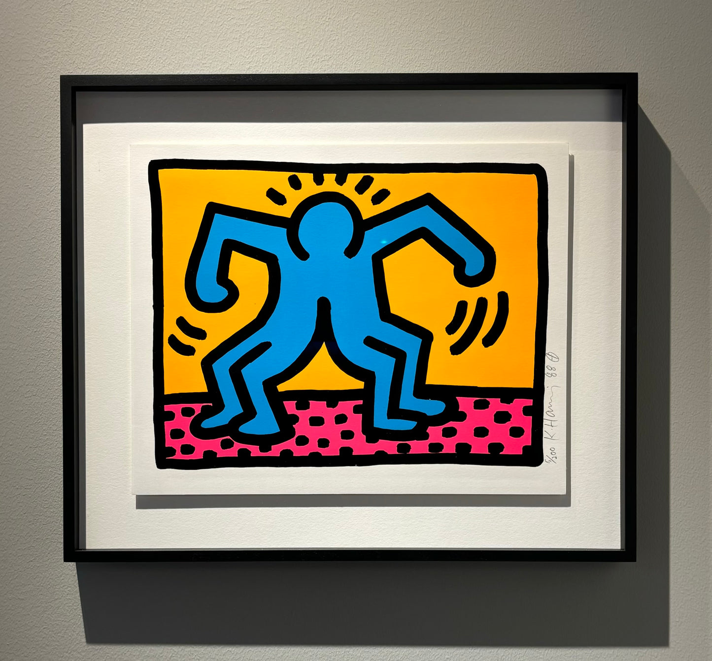 Pop Shop II (1988) by Keith Haring – A signed and dated silkscreen from an edition of 200, framed. The work showcases Haring’s iconic, bold lines and vibrant colors, capturing his signature style of social activism through playful yet powerful imagery.